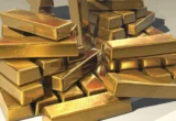 Harga Emas Naik 1 Persen Ditekan Minyak dan Suku Bunga AS