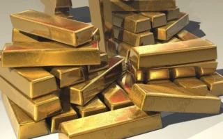 Harga Emas Naik 1 Persen Ditekan Minyak dan Suku Bunga AS